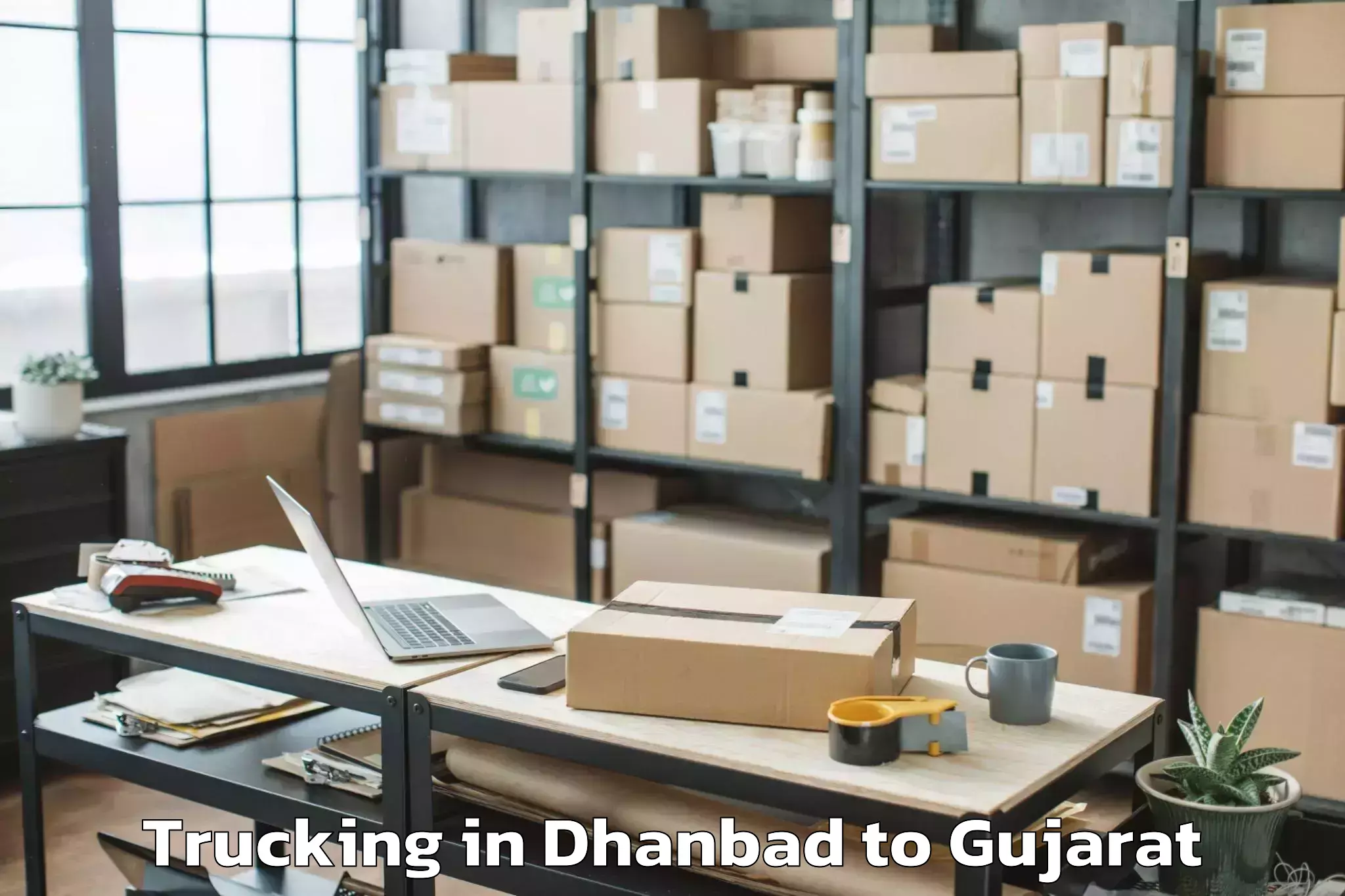 Book Your Dhanbad to Gujarat National Law Universit Trucking Today